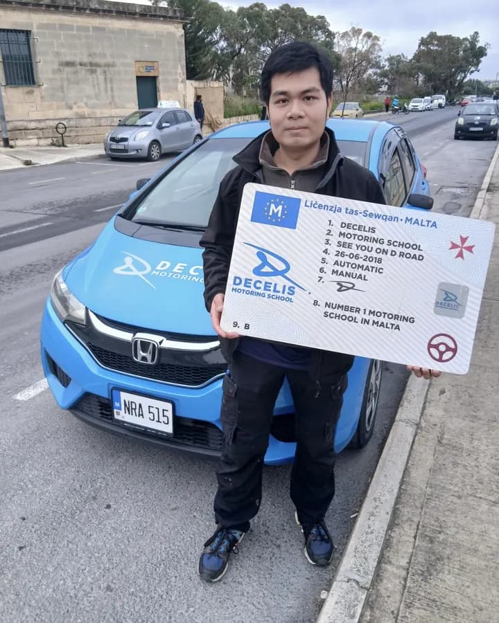 A new driver on pass day, in front of a Decelis Honda Jazz