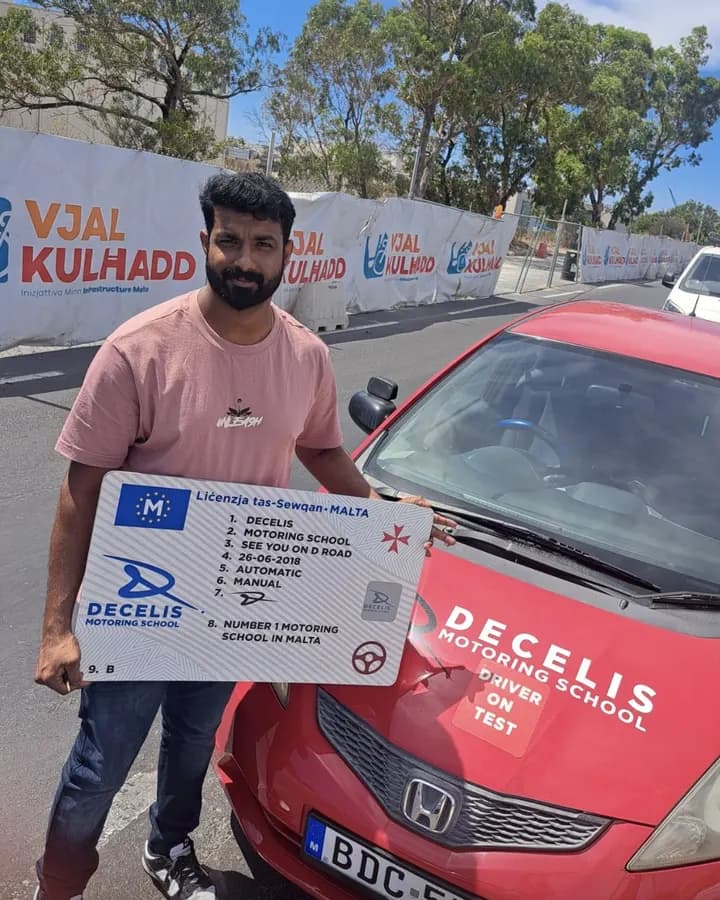 A new driver on pass day, in front of a Decelis Honda Jazz