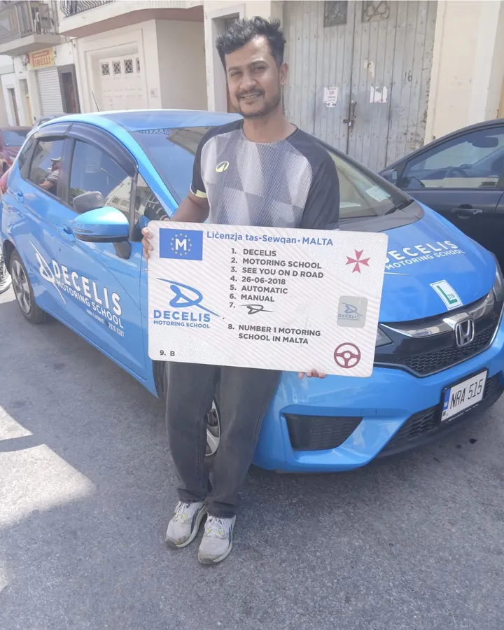 A new driver on pass day, in front of a Decelis Honda Jazz